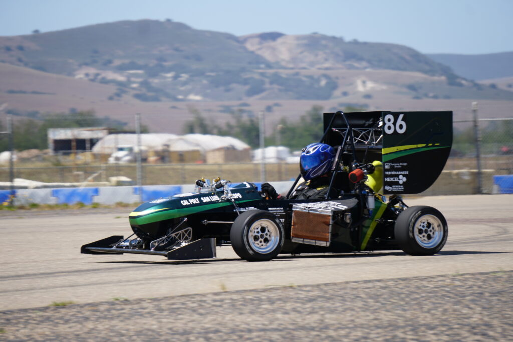 Business student Tommy Bordeaux drives the Formula car designed and built by the Cal poly Racing club.