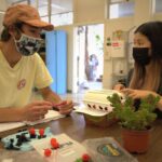 Colton O’Connell, a business administration major with a concentration in consumer packaging from San Diego, left, and Serena Pu, an industrial technology and packaging student from San Jose, work on their sustainable packaging prototype in a packaging development class. Students in Cal Poly’s Industrial Technology and Packaging program are encouraged to explore and study sustainable methods as alternatives to single-use plastics.