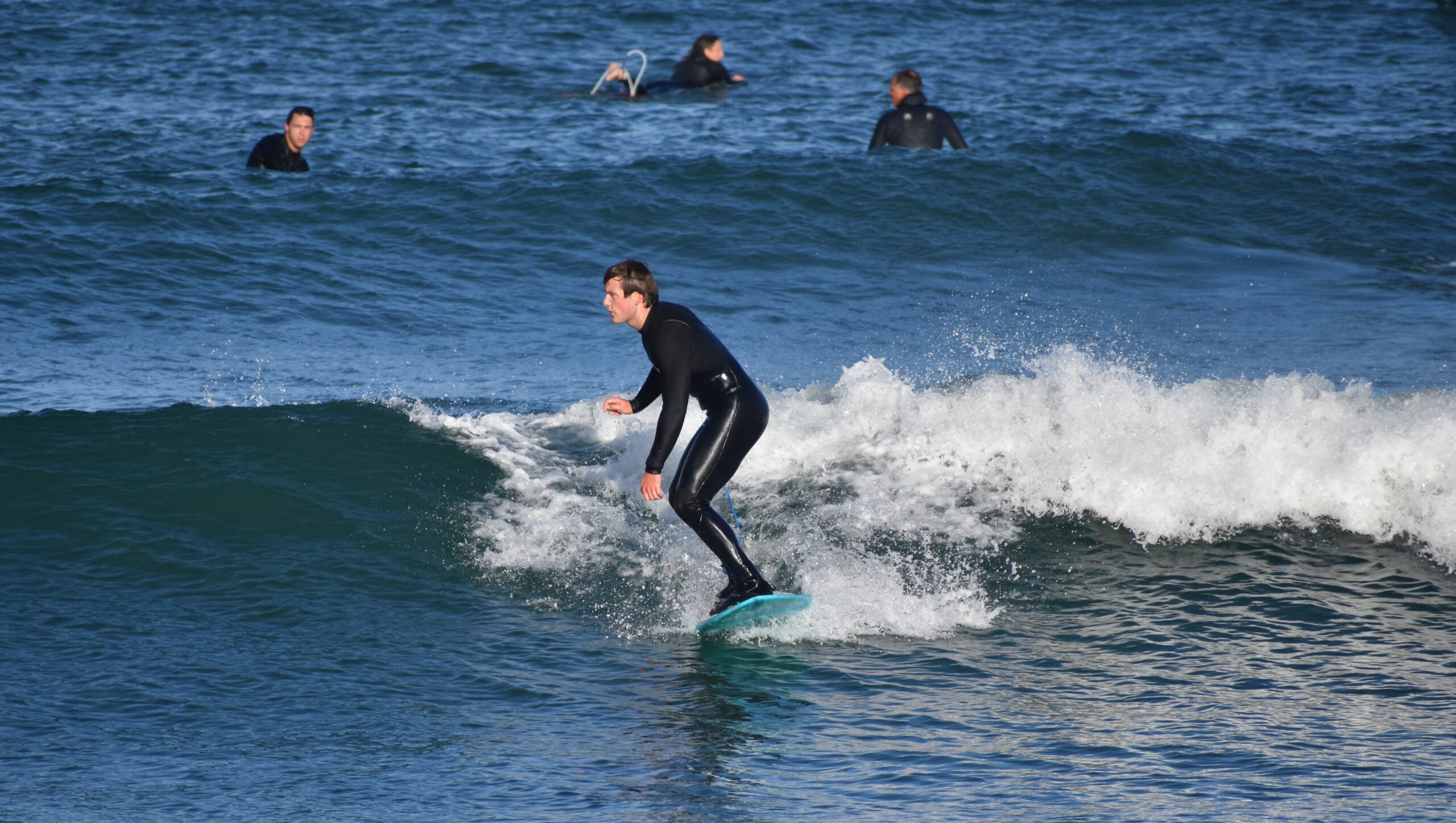 Jackson Prudhon riding a wave next to Morro Rock.