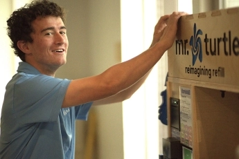 Colin Brown demonstrating Mr. Turtle's product dispenser
