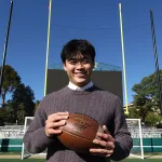 Spencer Zhang, on the football field at Spanos Stadium